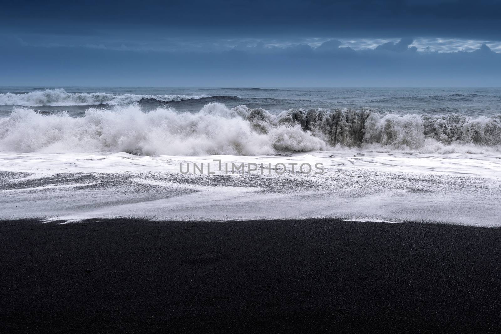 Black sand beach and ocean waves in Iceland. by gutarphotoghaphy