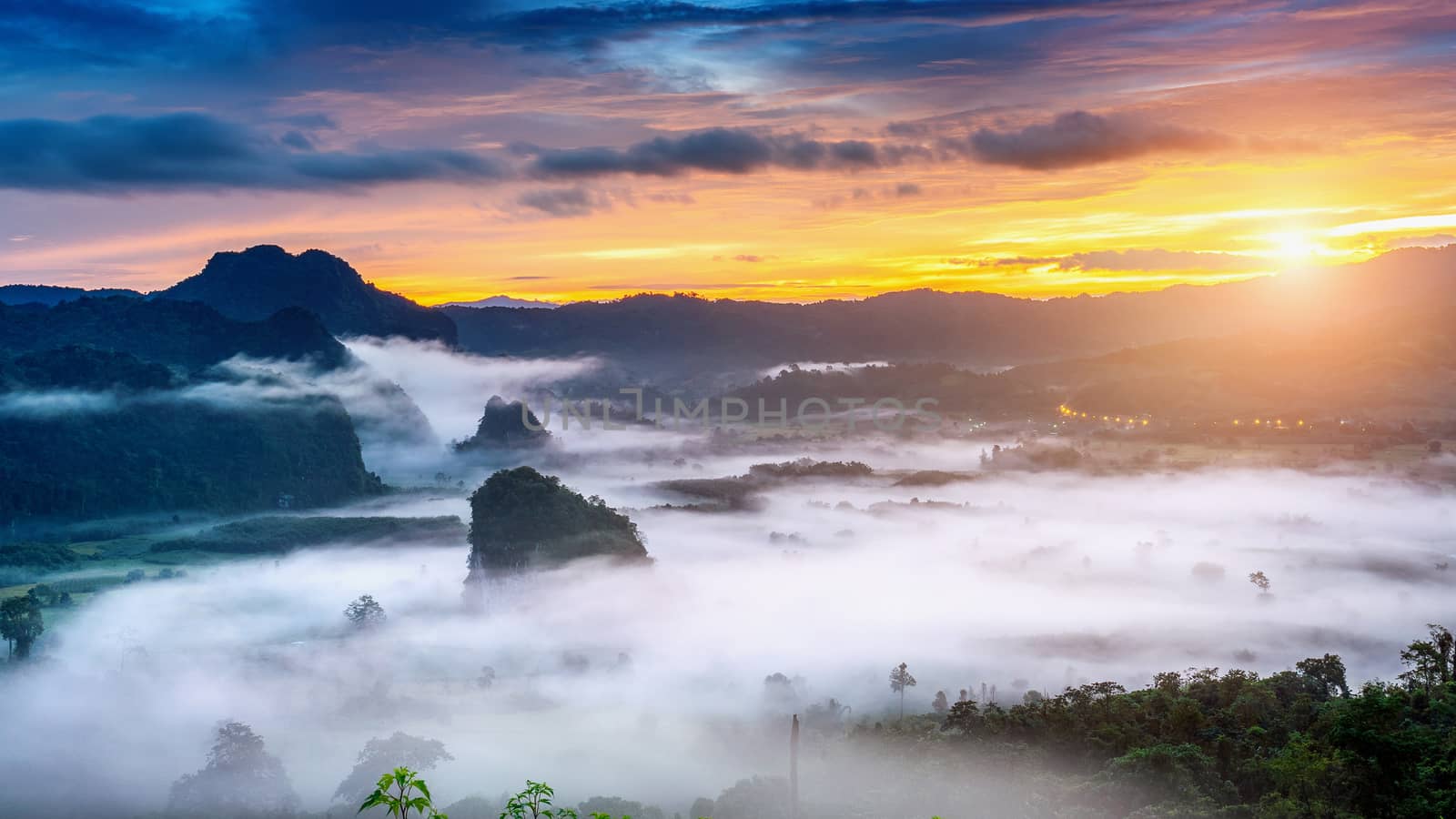 Sunrise on the morning mist at Phu Lang Ka, Phayao in Thailand. by gutarphotoghaphy