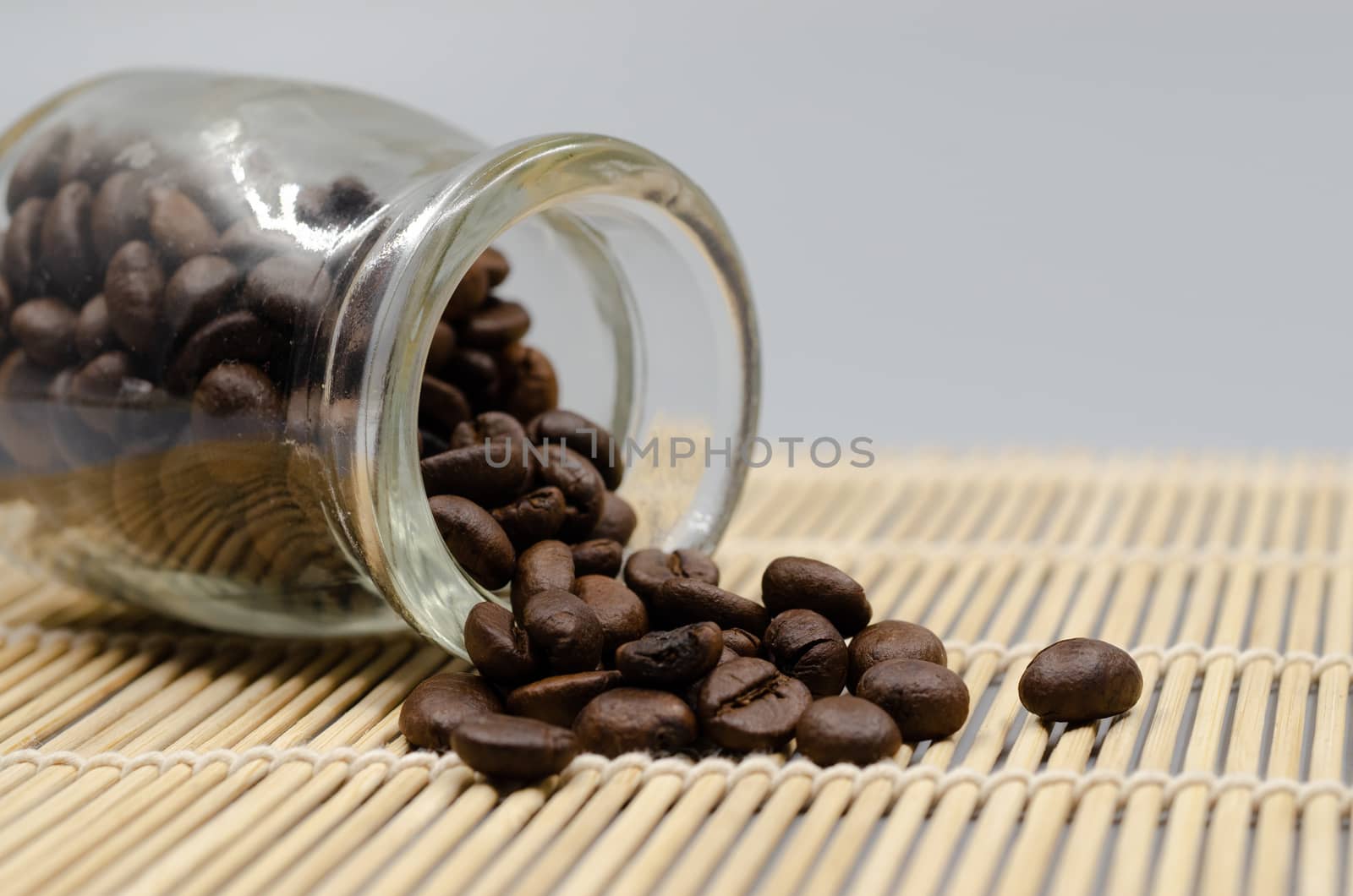 Coffee beans in a dozen glasses on the table.