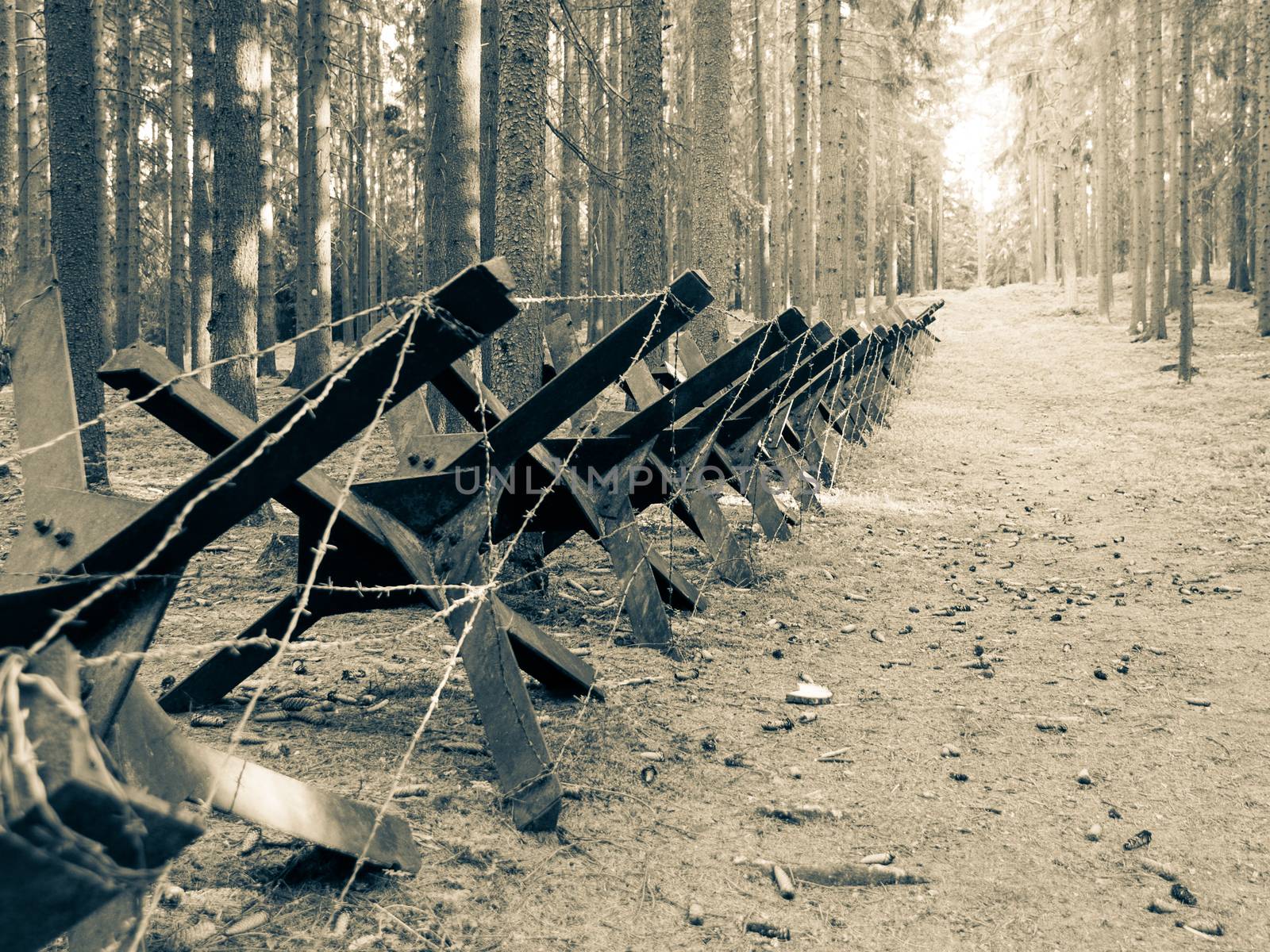 Iron anti-tank barrier from World War II. Retro sepia style image.