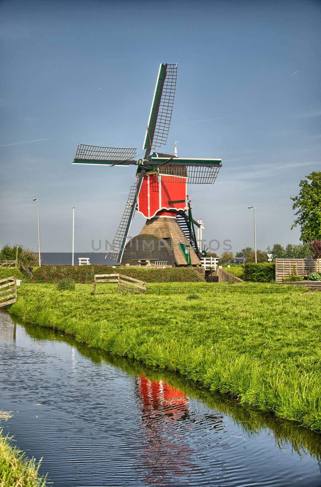 Windmills and water canal in Kinderdijk, Holland or Netherlands. by Eagle2308