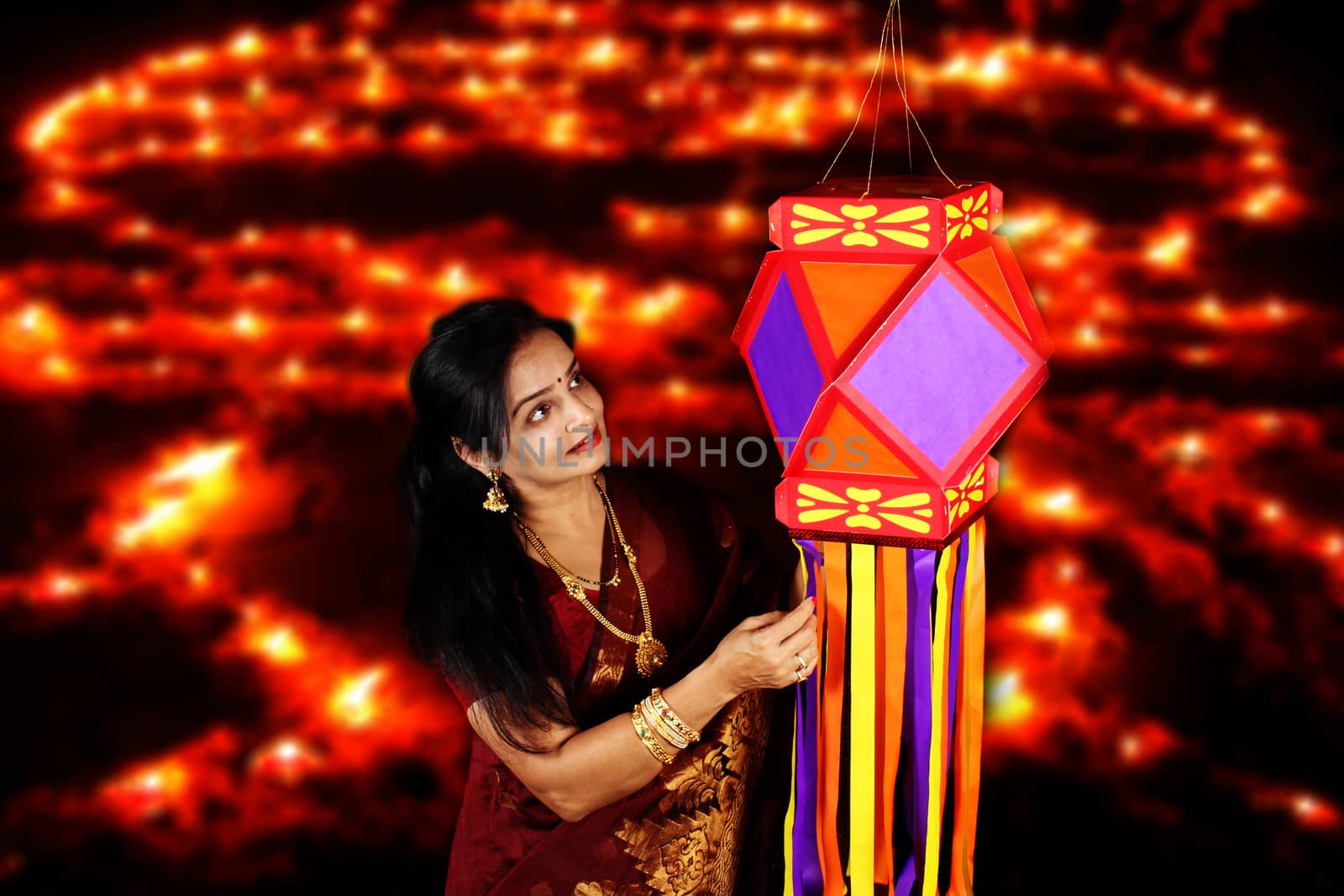 Indian Woman admiring her Diwali Lantern by thefinalmiracle