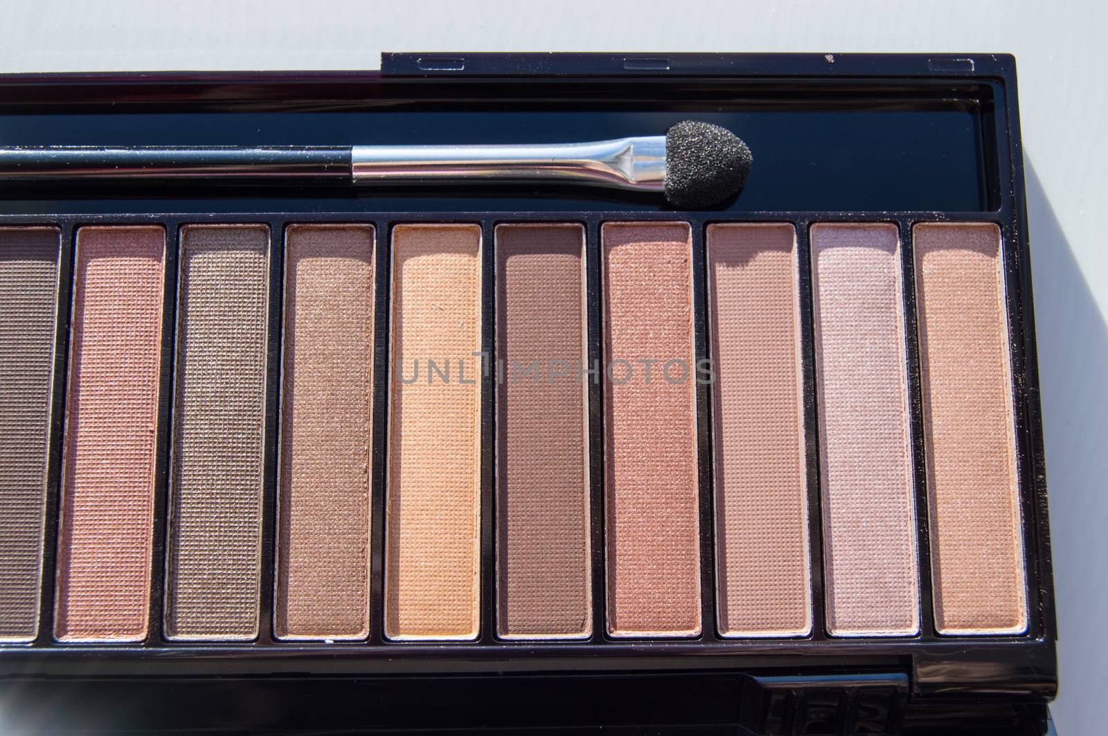 Cosmetic palette with brush and eye shadow with light brown, beige and Nude eyeshadow by claire_lucia