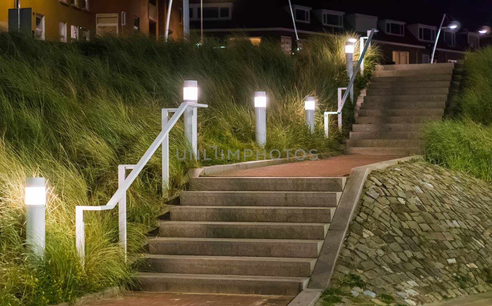 stone city staircase going up with light lanterns urban cityscape scenery of the streets at night