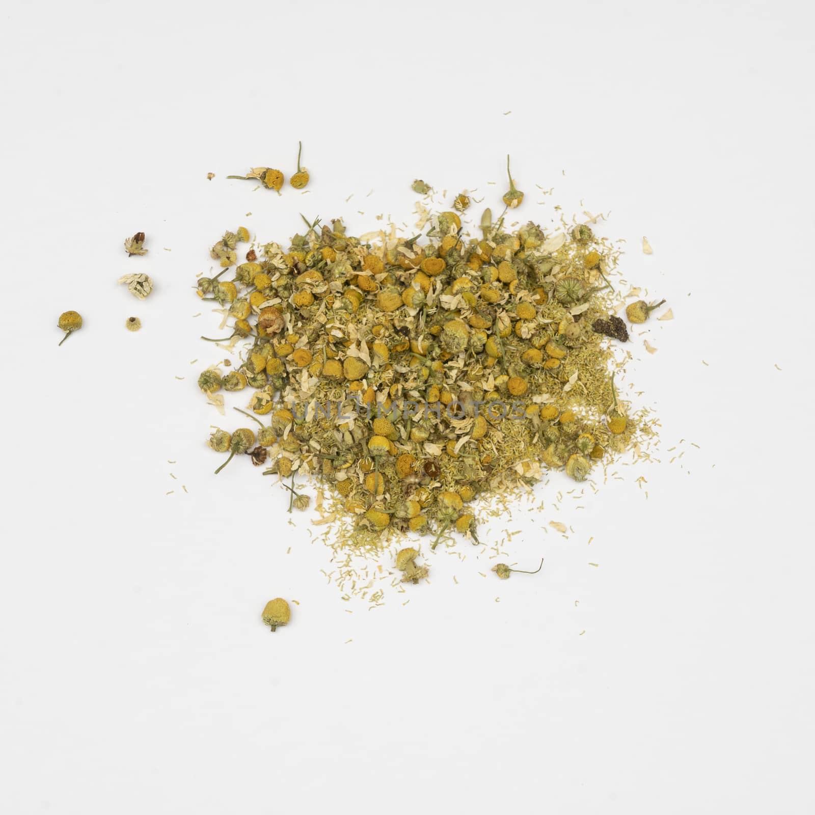dried chamomile flowers in a white table