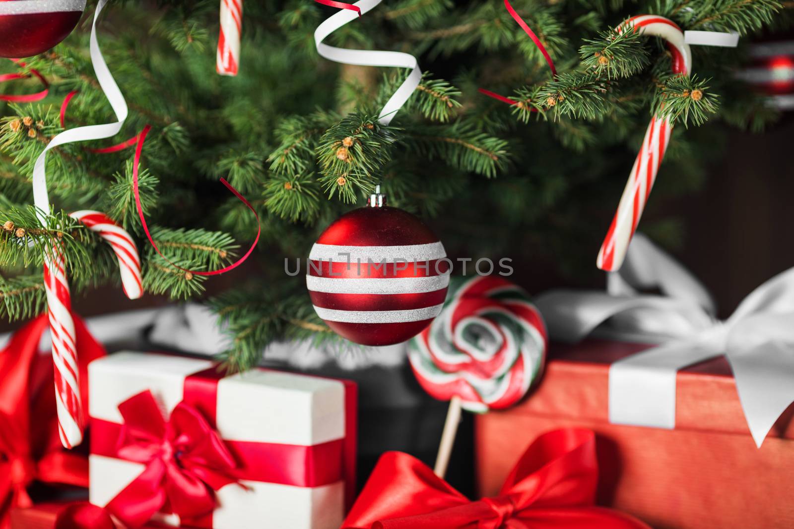 Merry christmas card with decorated christmas tree and gifts
