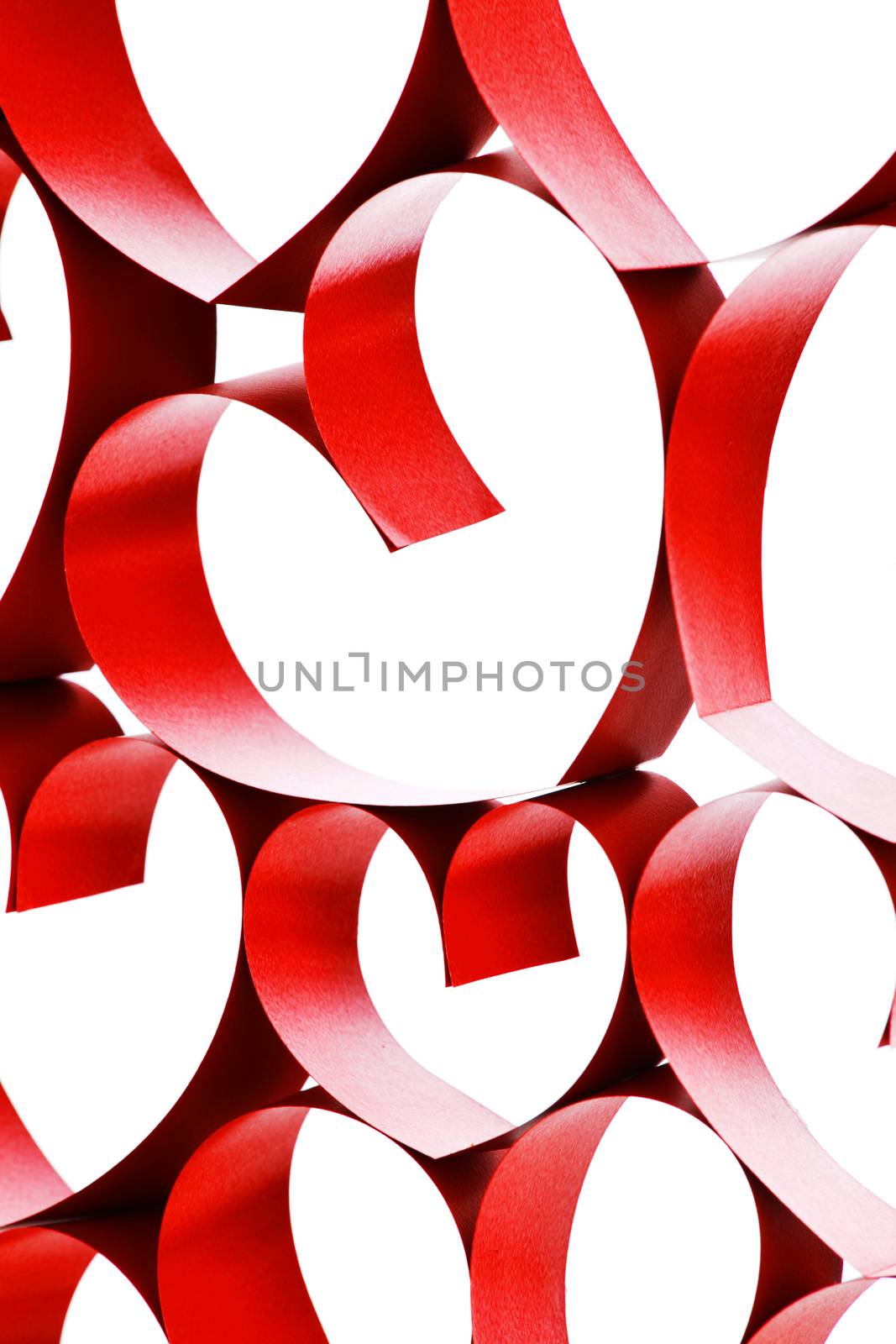 Linked red ribbon hearts isolated on white background