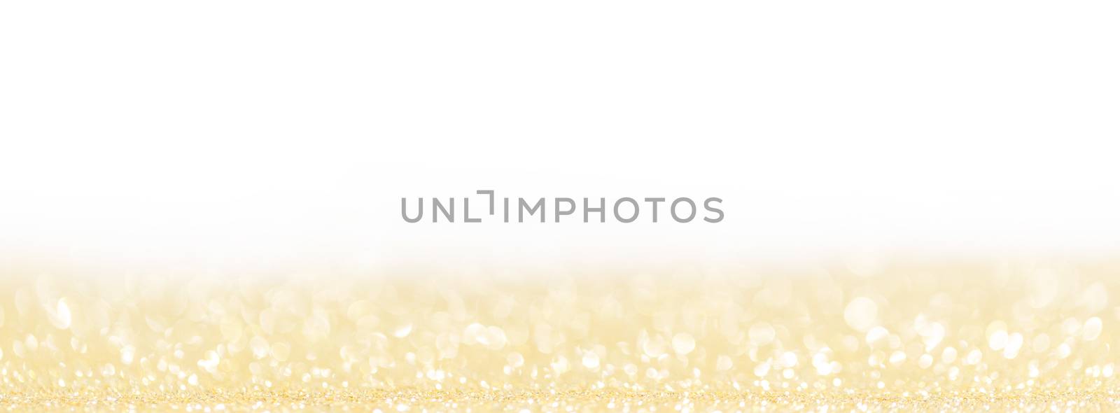 Abstract shining glitters golden on white holiday bokeh background with copy space for text