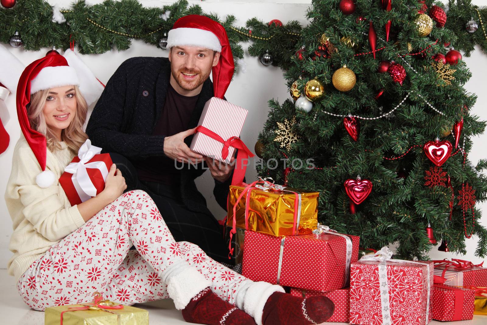 Couple with Christmas gifts by ALotOfPeople