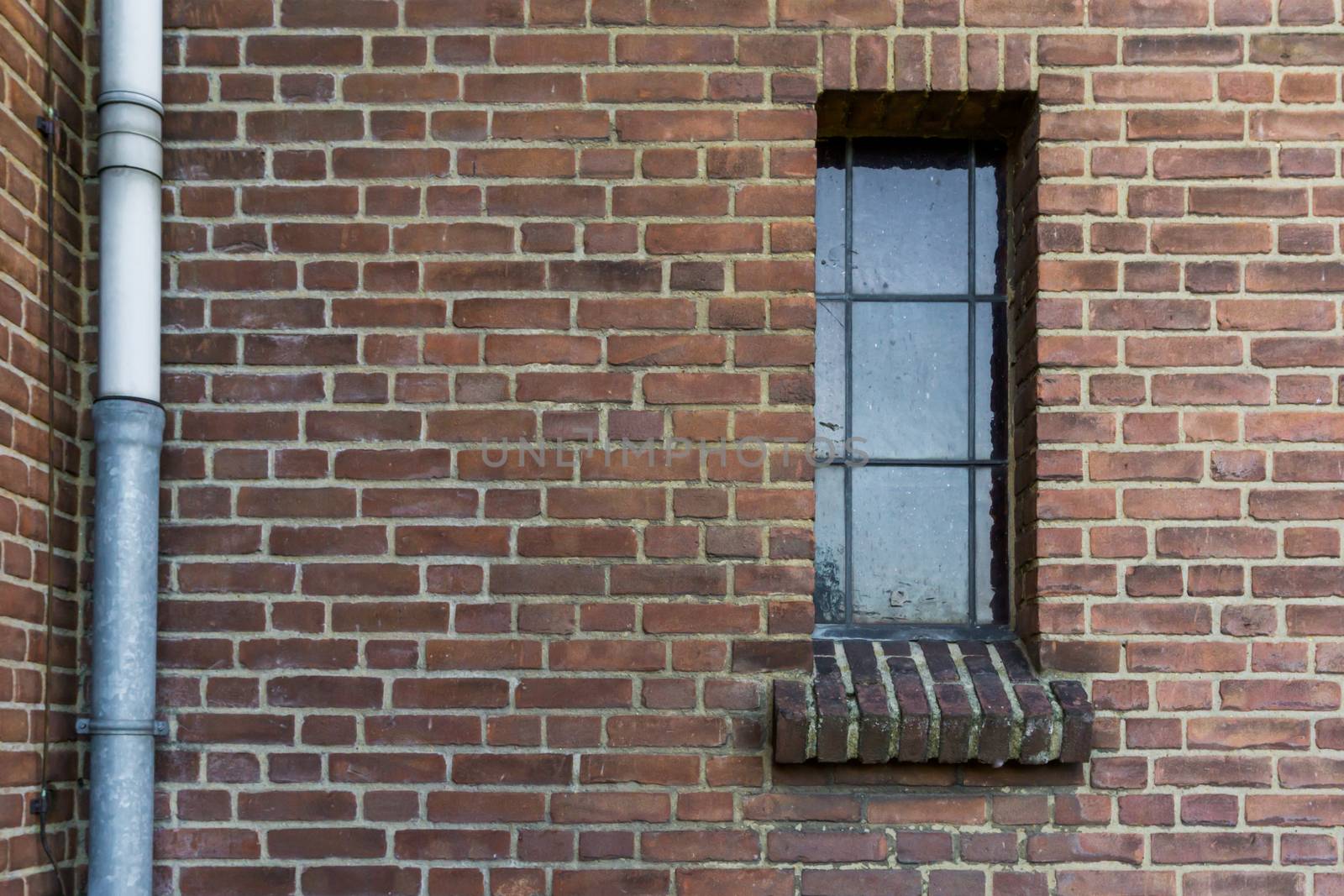 stone brick wall pattern with a old dirty glass window framework in stained glass retro architecture background