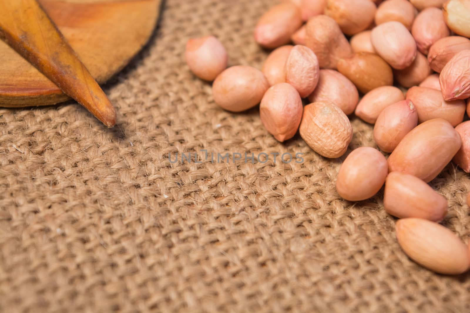 Group of Garlic and grounnuts with some props on sackcloth for food. by lakshmiprasad.maski@gmai.com