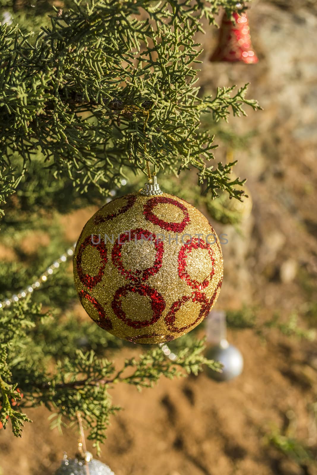 Decorated Christmas tree in the forest at nature background.