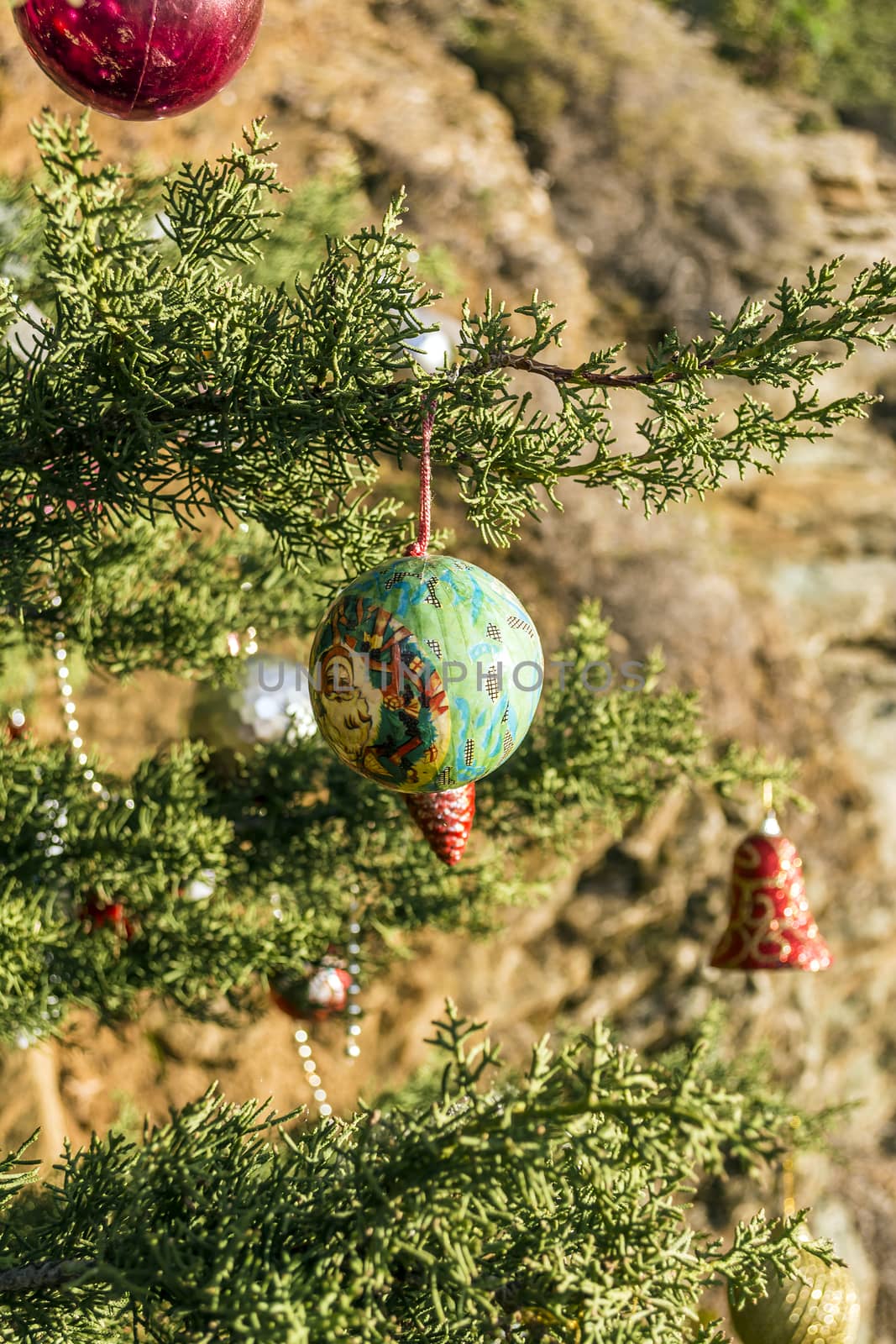 Decorated Christmas tree in the forest at nature background.