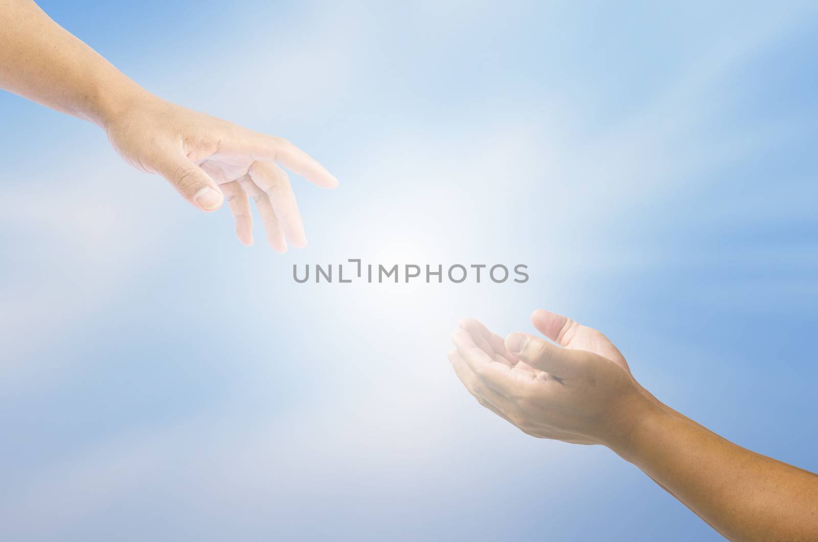 Hand trying to catch up on a background of sky and light - for help by photobyphotoboy