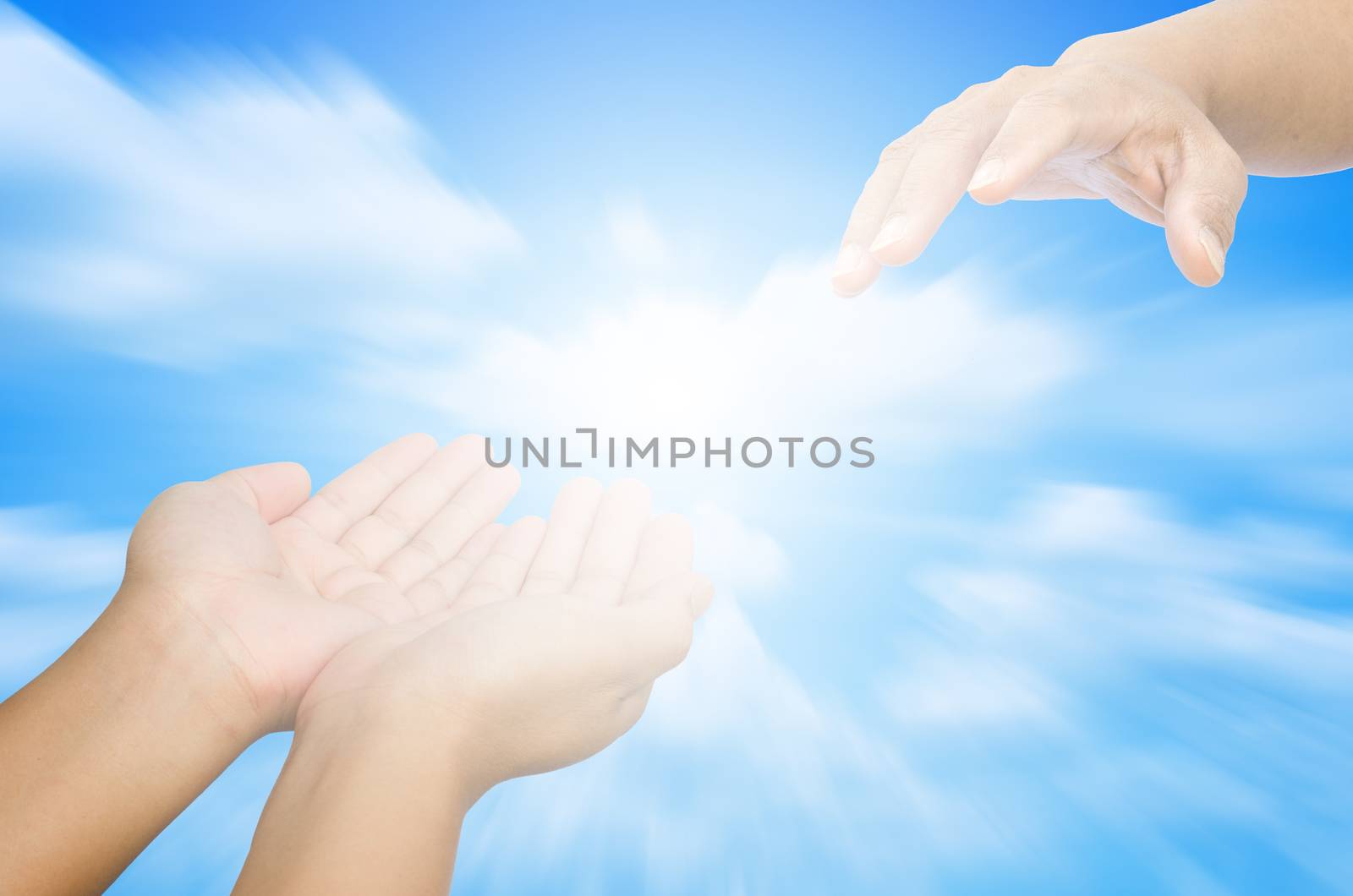 Hand trying to catch up on a background of sky and light - for help by photobyphotoboy