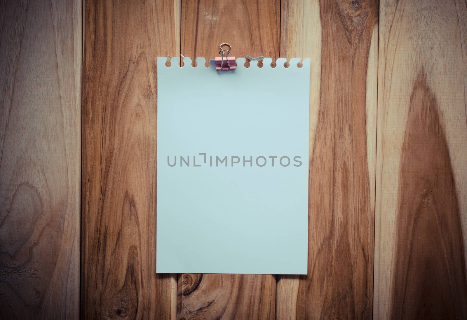 paper note on wooden background by photobyphotoboy