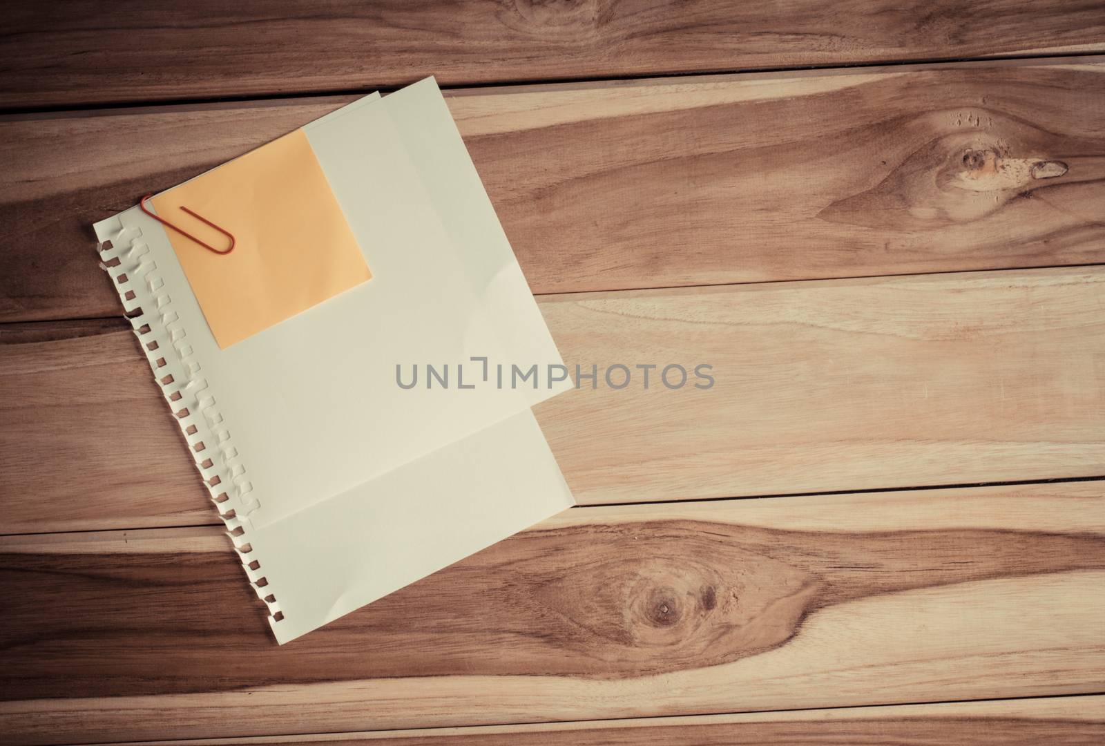paper note on wooden background by photobyphotoboy