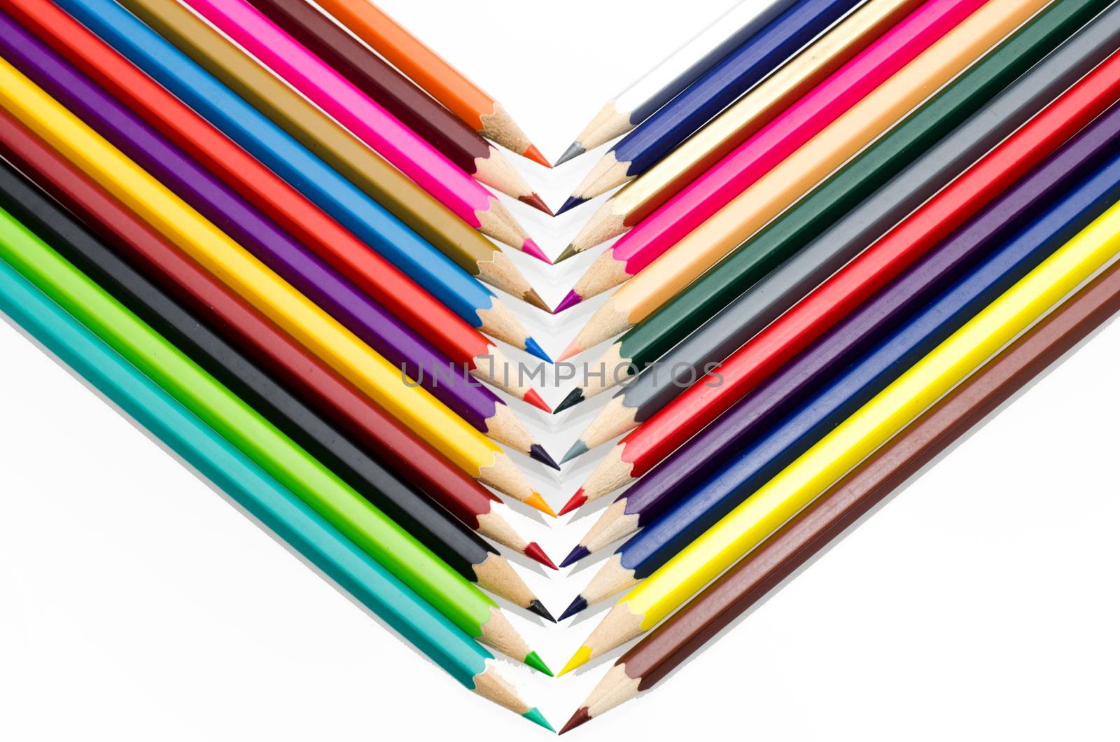 Colour pencils isolated on white background close up by photobyphotoboy