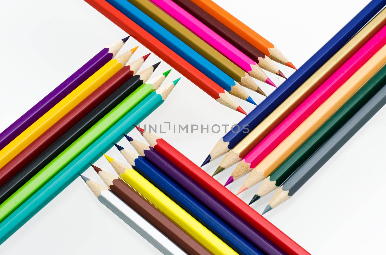 Colour pencils isolated on white background close up by photobyphotoboy