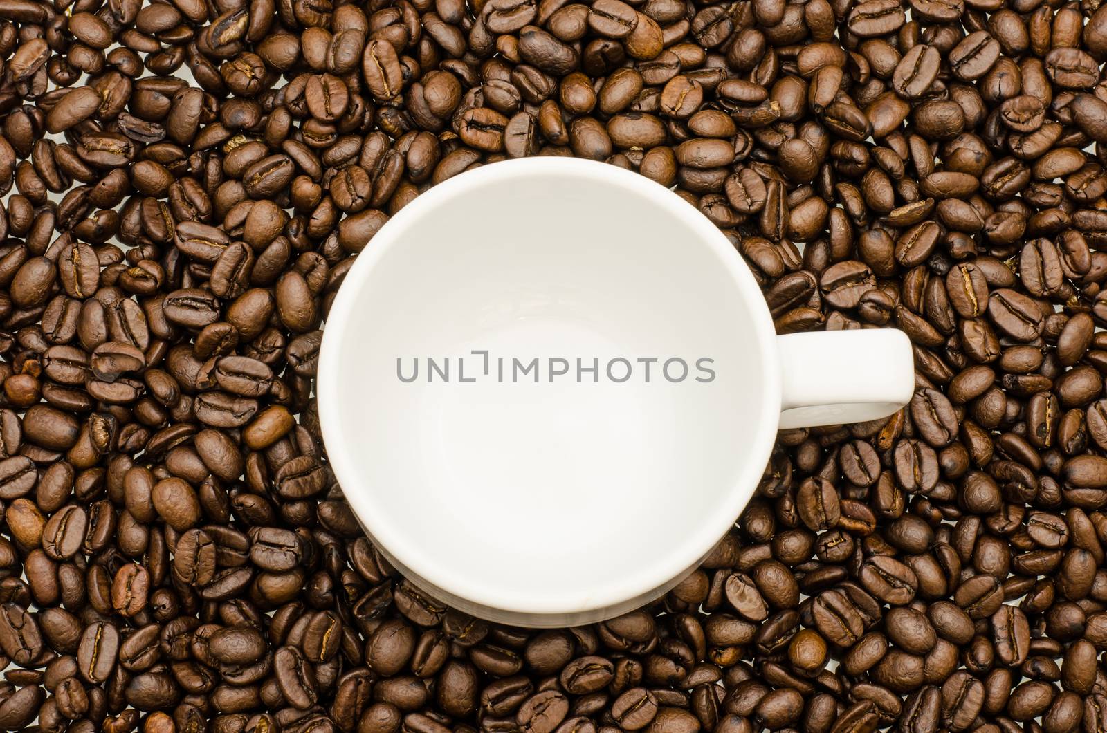 coffee cup  on coffee beans by photobyphotoboy