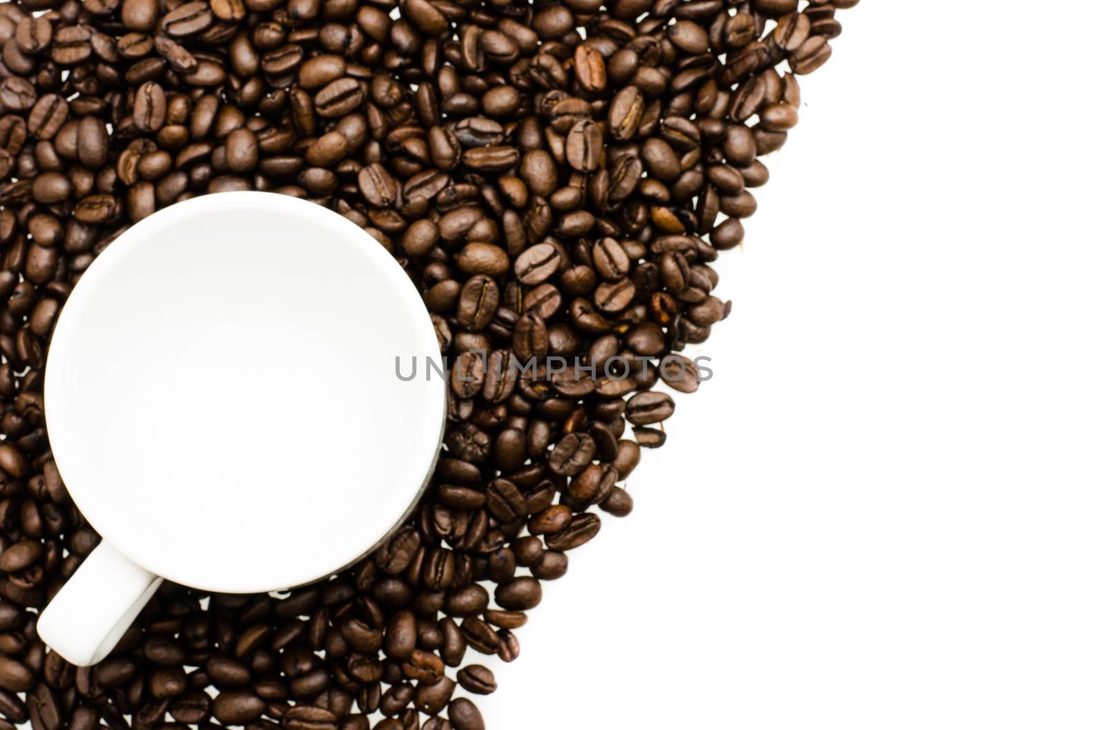 coffee cup  on coffee beans by photobyphotoboy