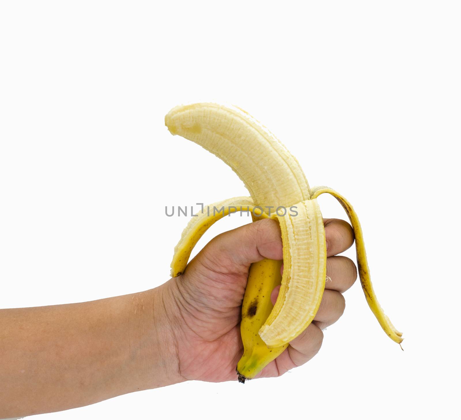 Ripe banana in the hand on white background by photobyphotoboy