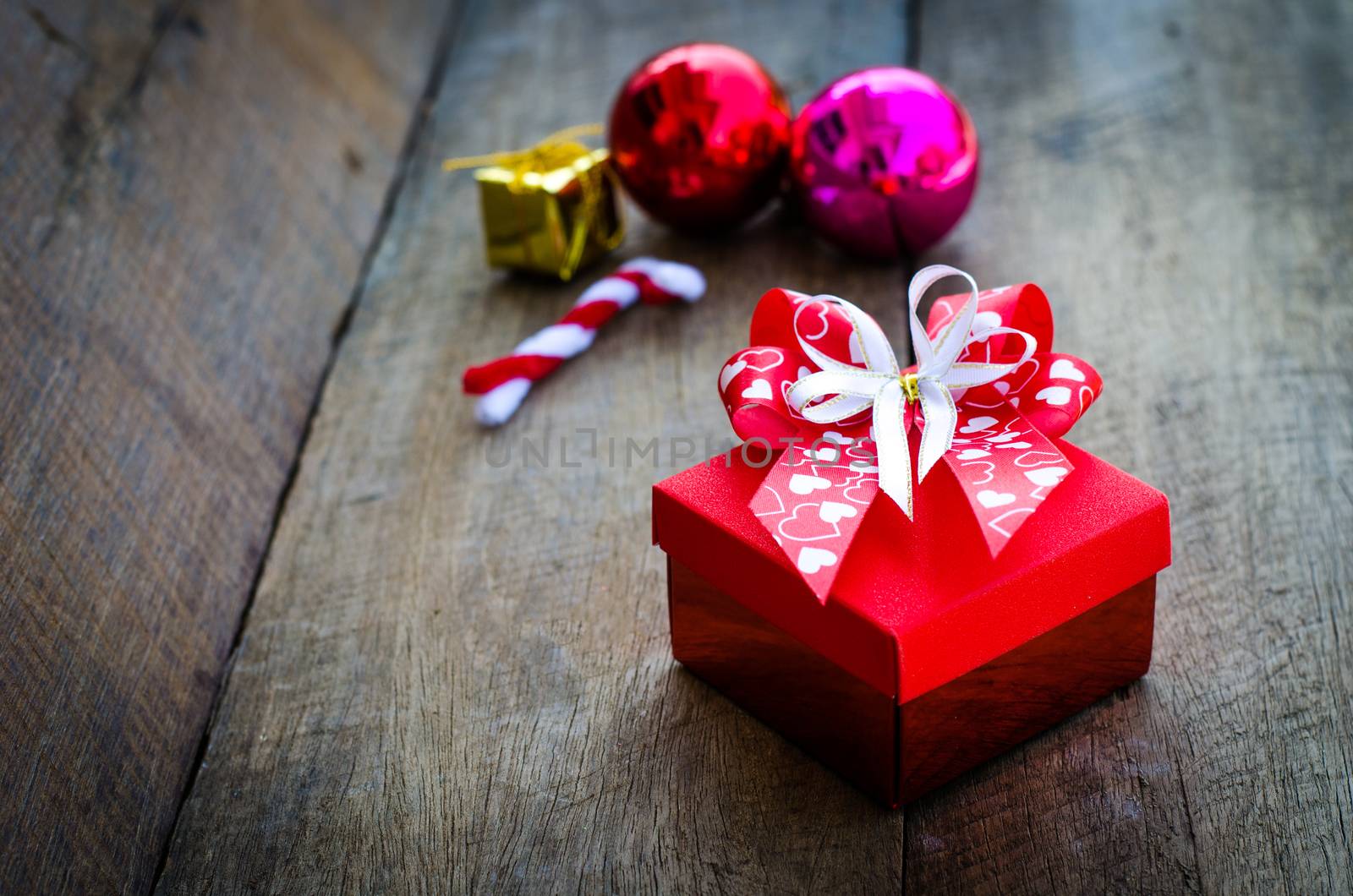 gift box on wooden background. by photobyphotoboy