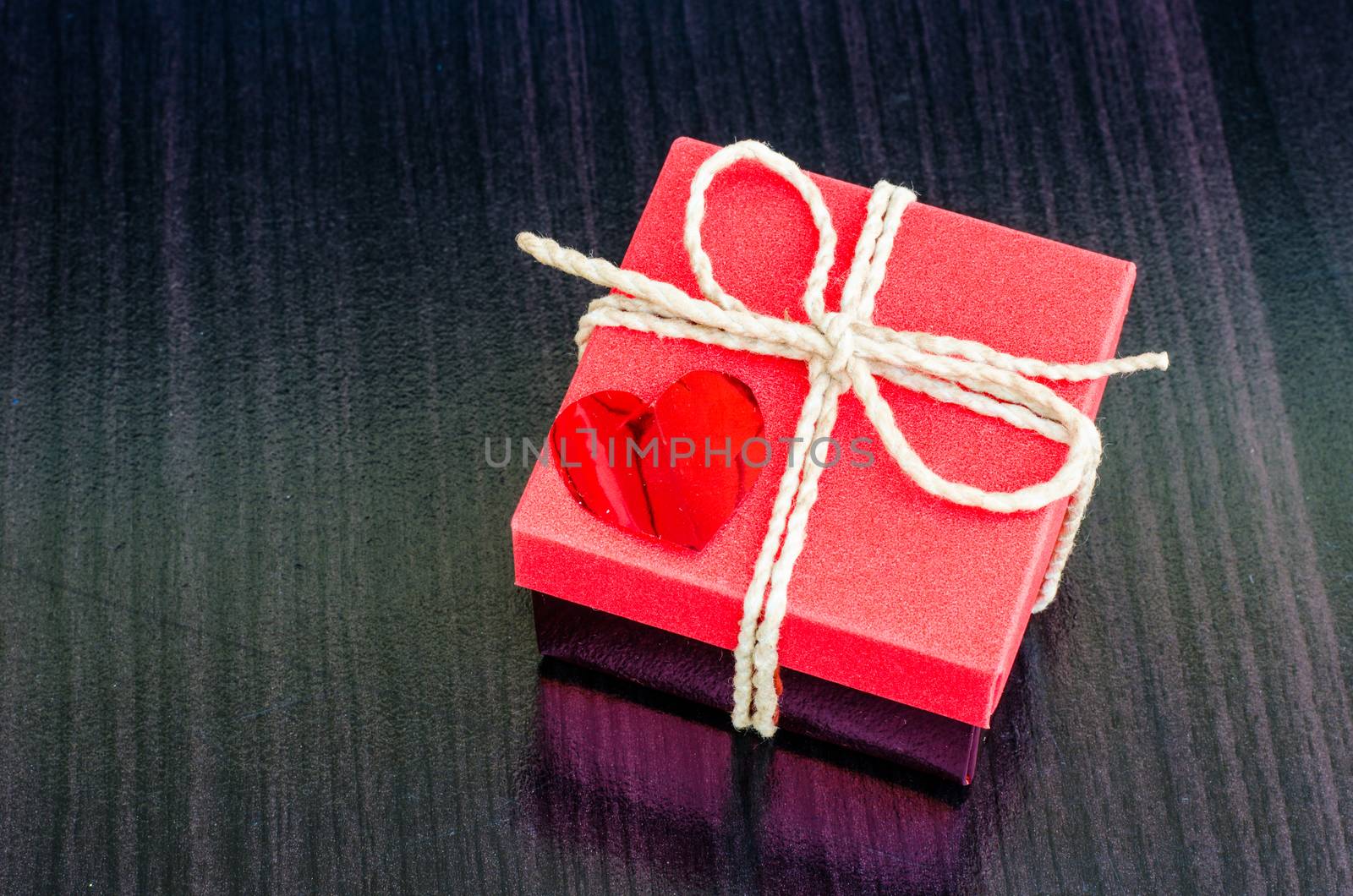 gift box on wooden background. by photobyphotoboy