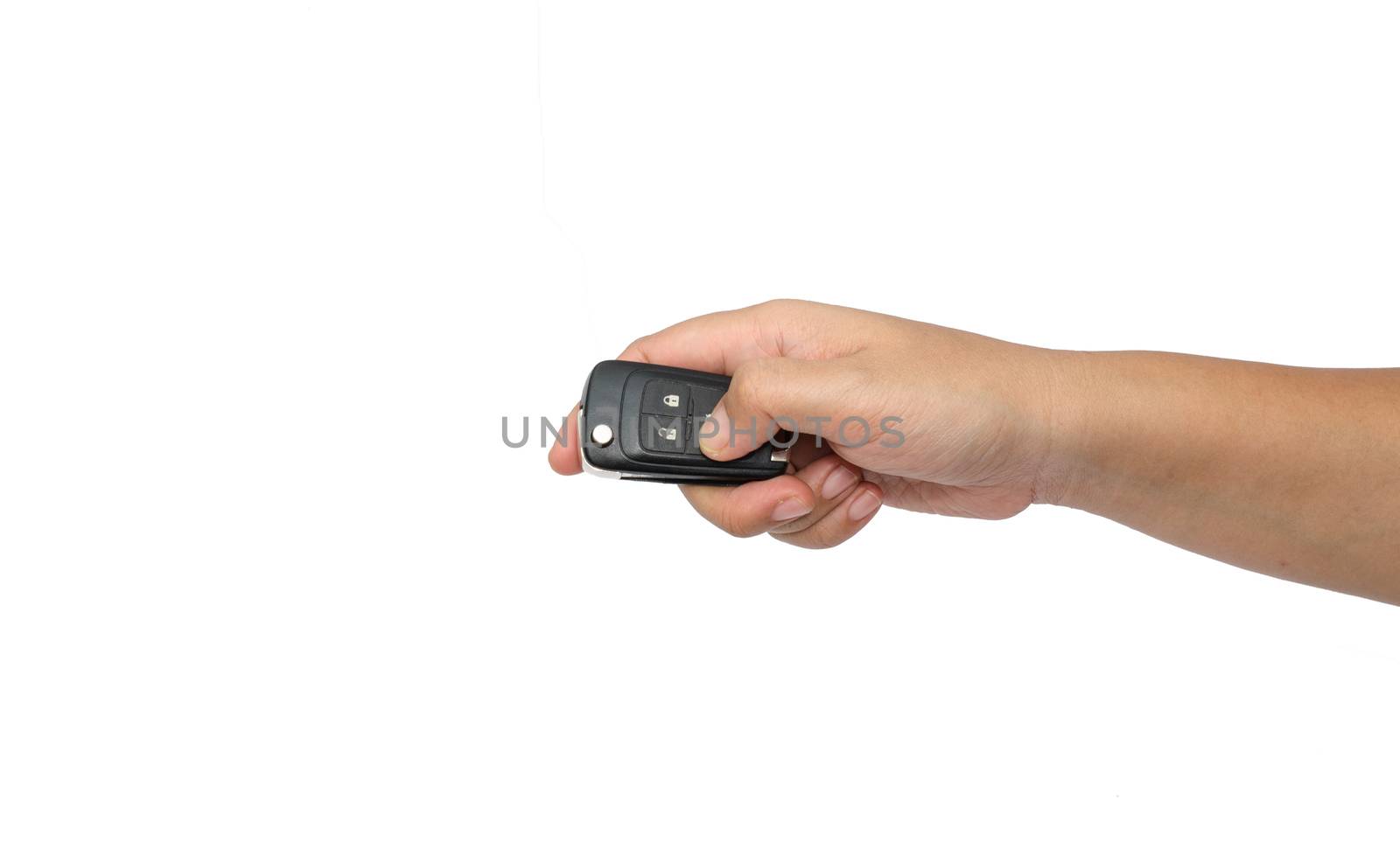 hand holding a car key isolated on white background