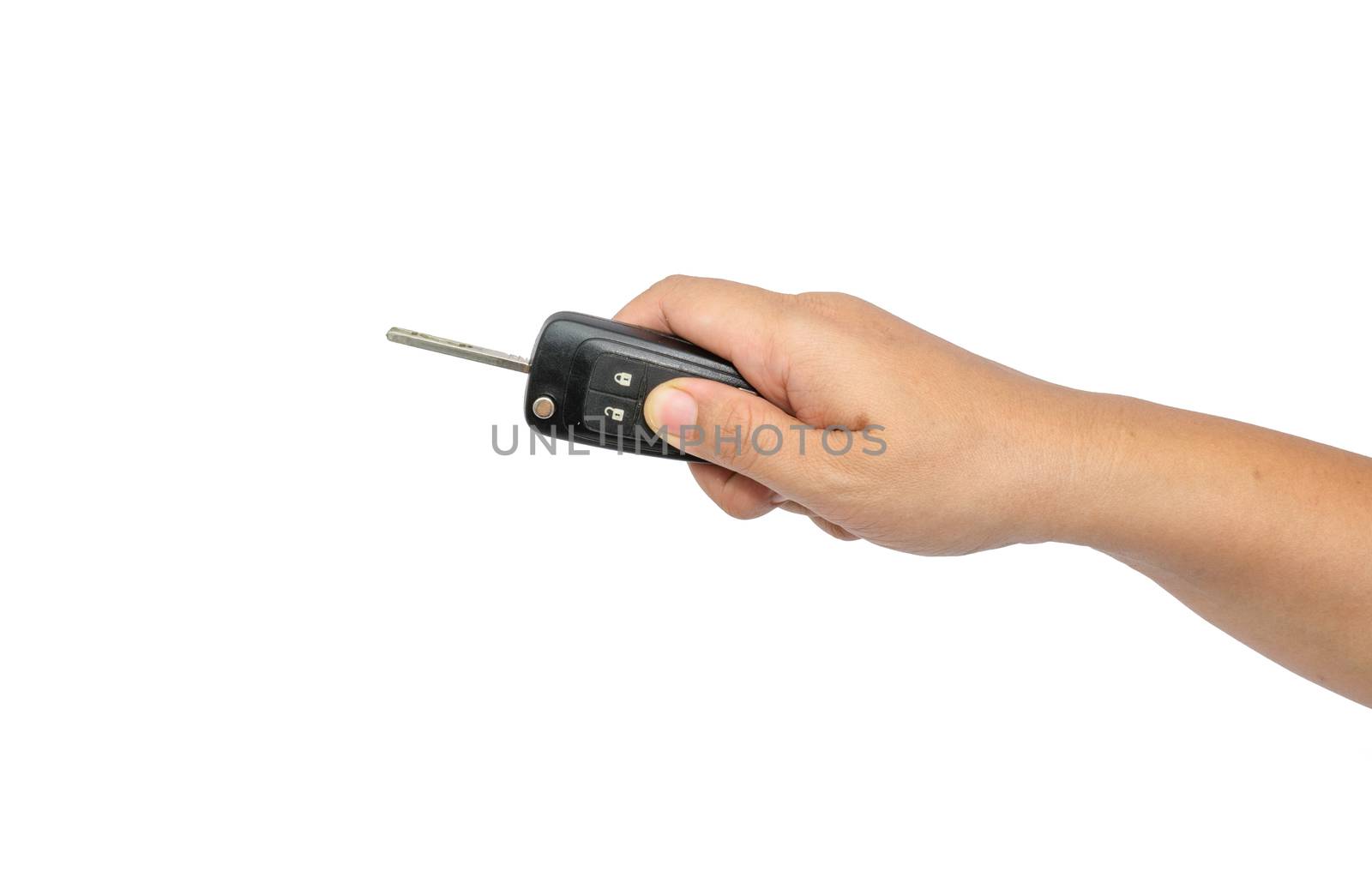 hand holding a car key isolated on white background