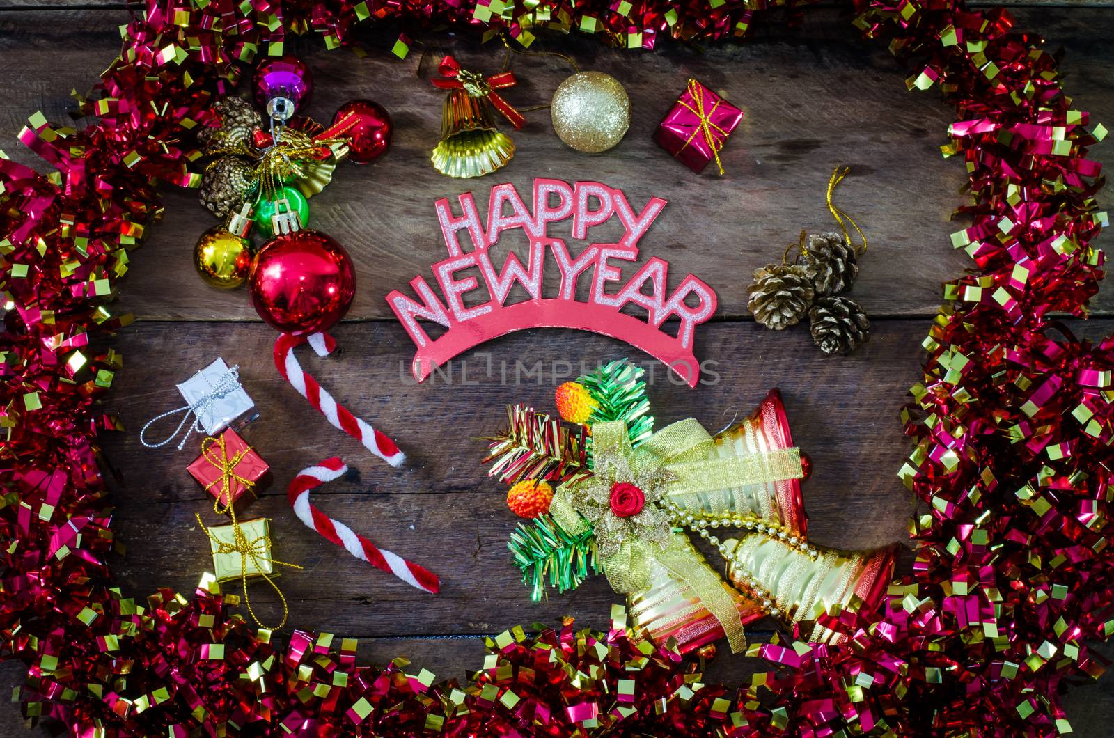  happy New Year message and gift box on wooden background. by photobyphotoboy