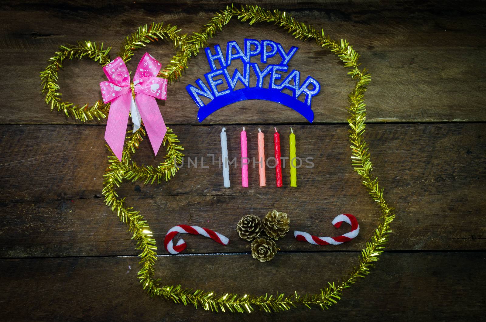 happy New Year message and gift box on wooden background. by photobyphotoboy