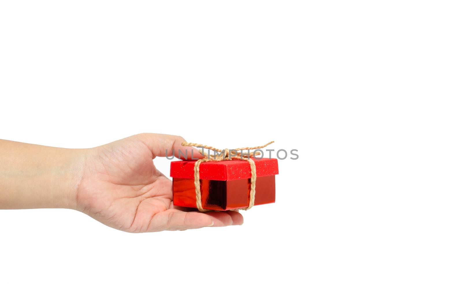 Small gift box in woman hand  by photobyphotoboy