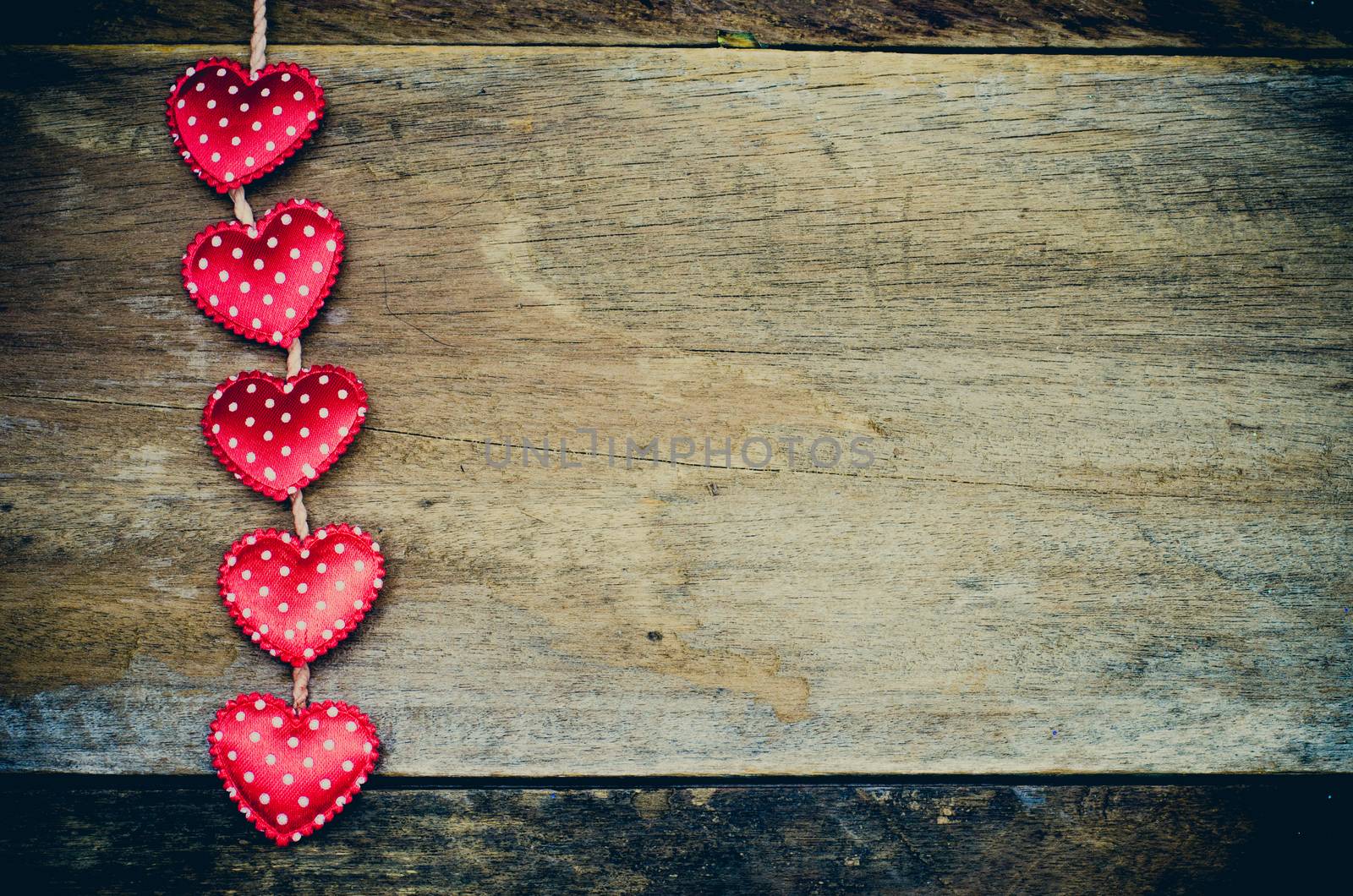 Love hearts on wooden background
