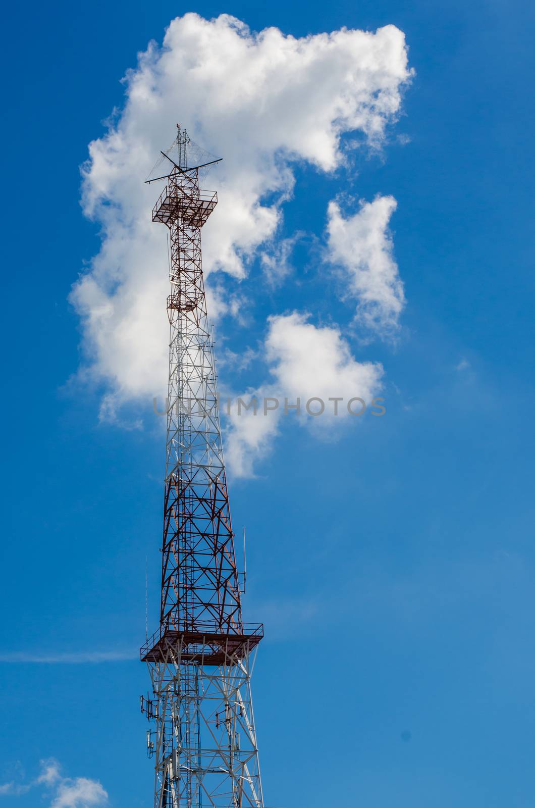 mobile antenna tower against blue sky background by photobyphotoboy