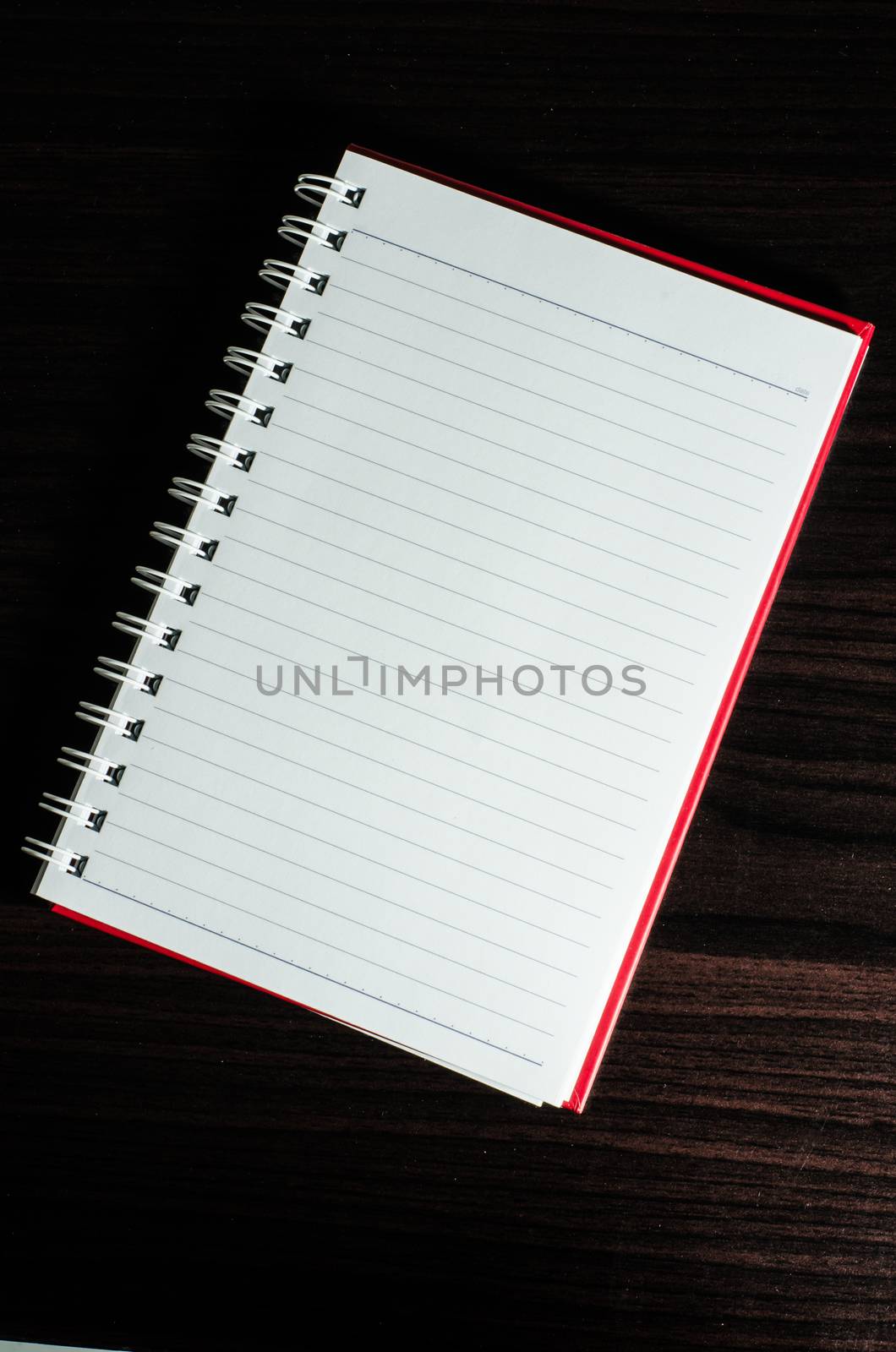 White open notebook on beech wood background