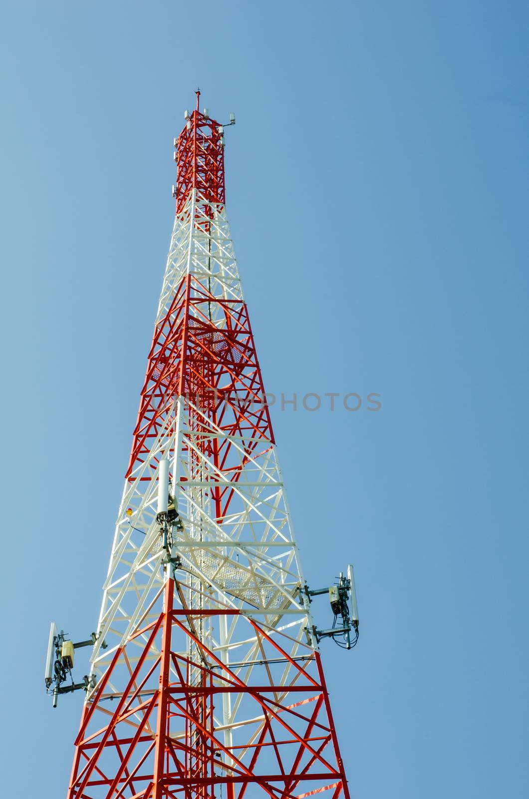 mobile antenna tower  against blue sky background