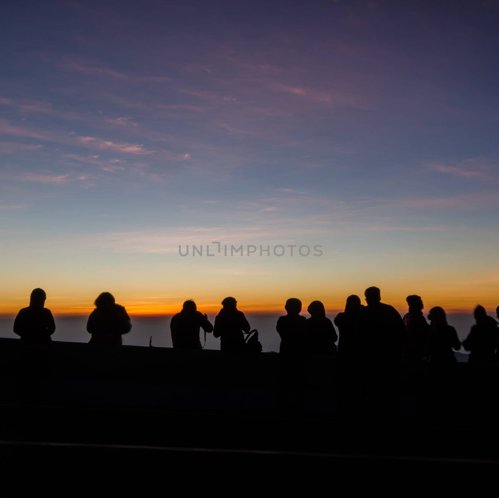 The people silhouette are waiting watch for the sun rise,in the morning