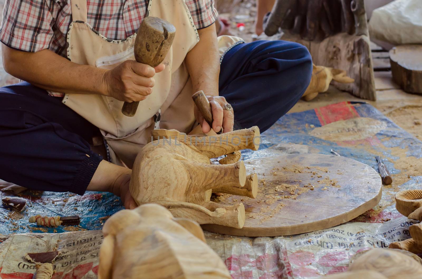 Carpenters are engraving woodwork.