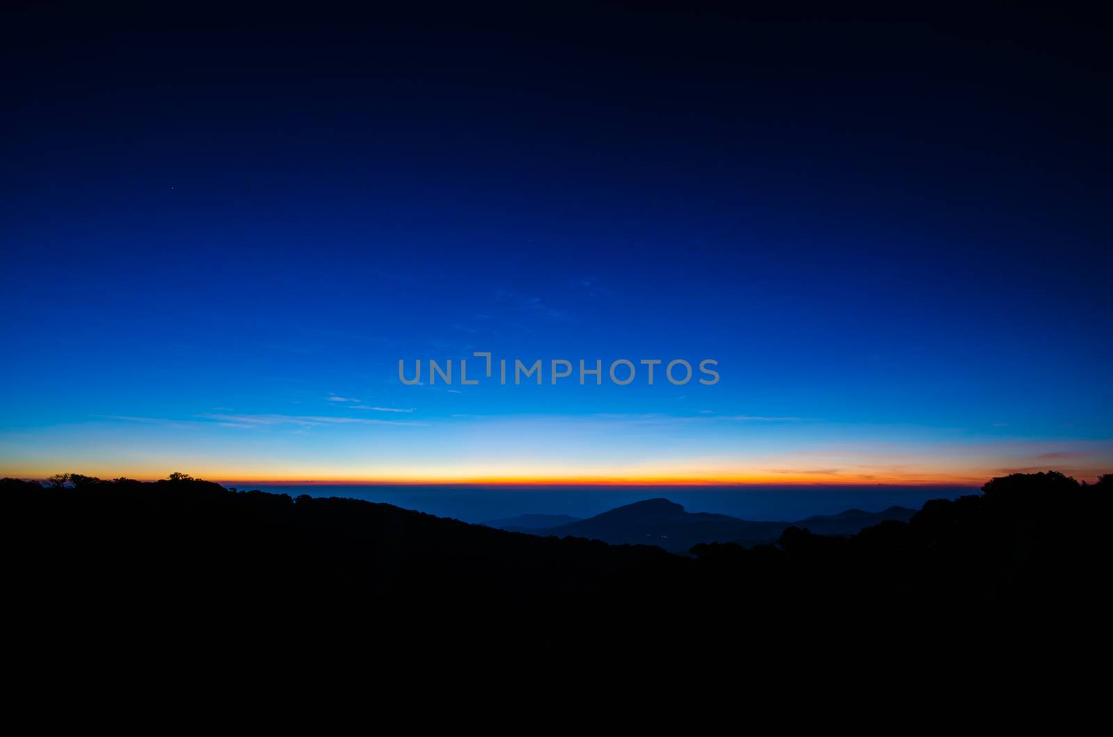 The sun was rising on the horizon,  Silhouetted in the morning. by photobyphotoboy
