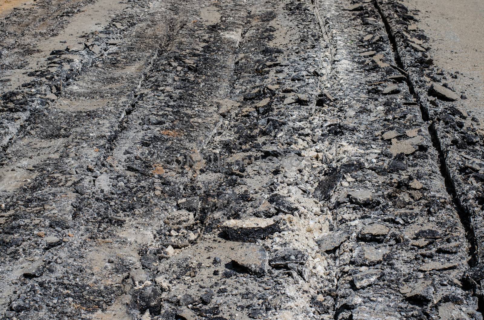 Road damage, with holes