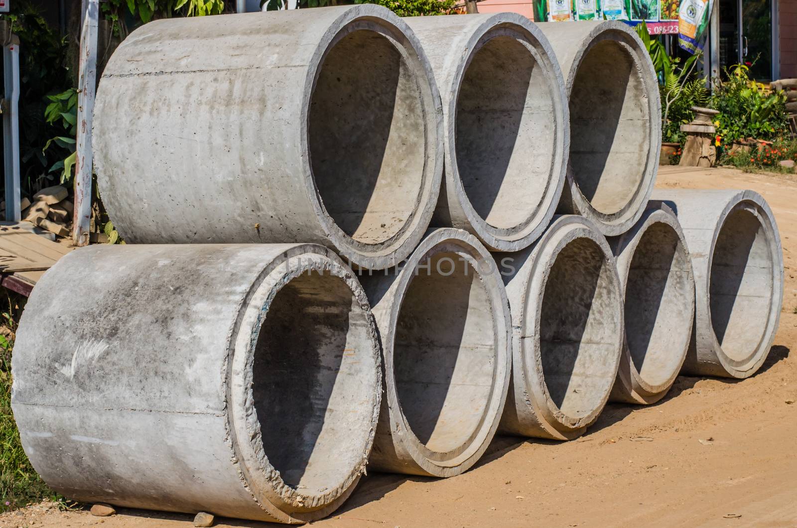 Cement pipes stacked by photobyphotoboy