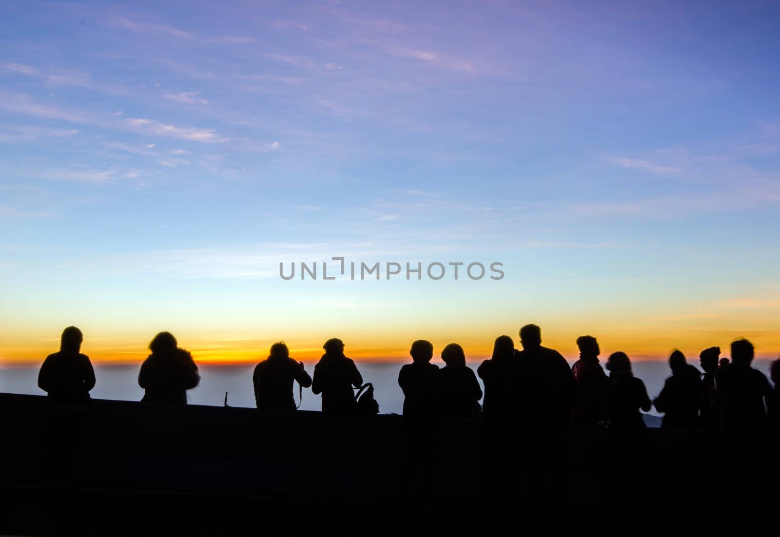 The people silhouette are waiting watch for the sun rise,in the morning