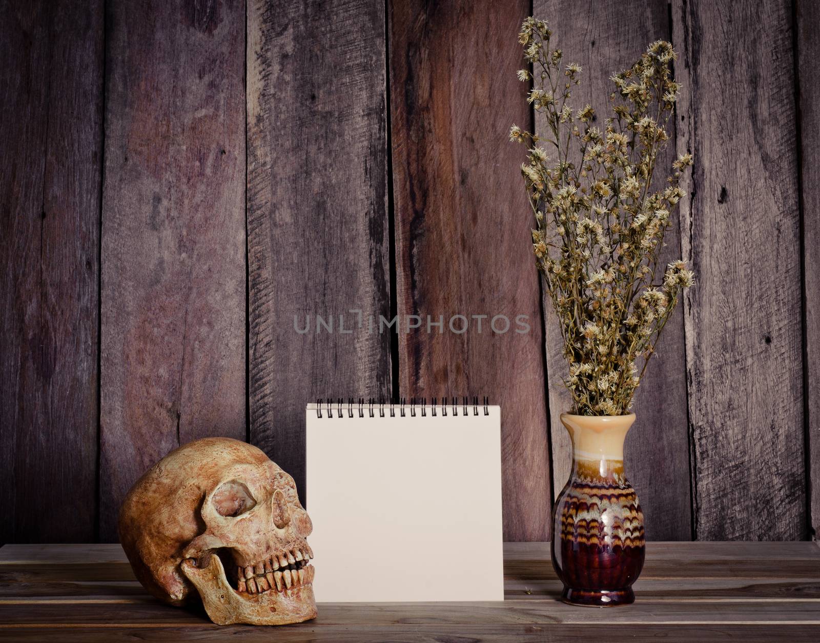 Still life picture frames, vases, dried rose notebook concept frequent memories
