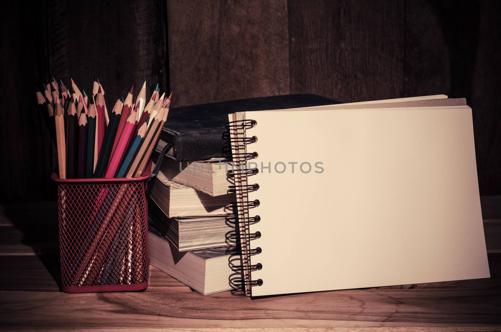 Still life color pencil and sketchbook on wooden background by photobyphotoboy