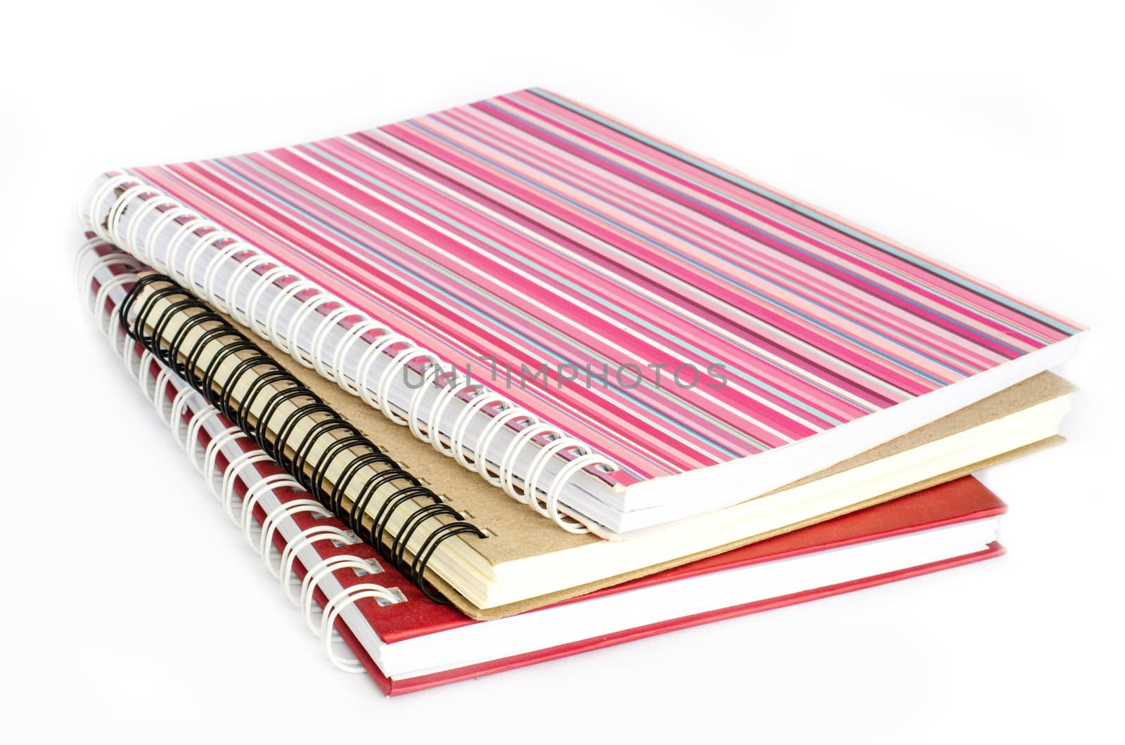 Notebook full of colorful rings put on a white background.