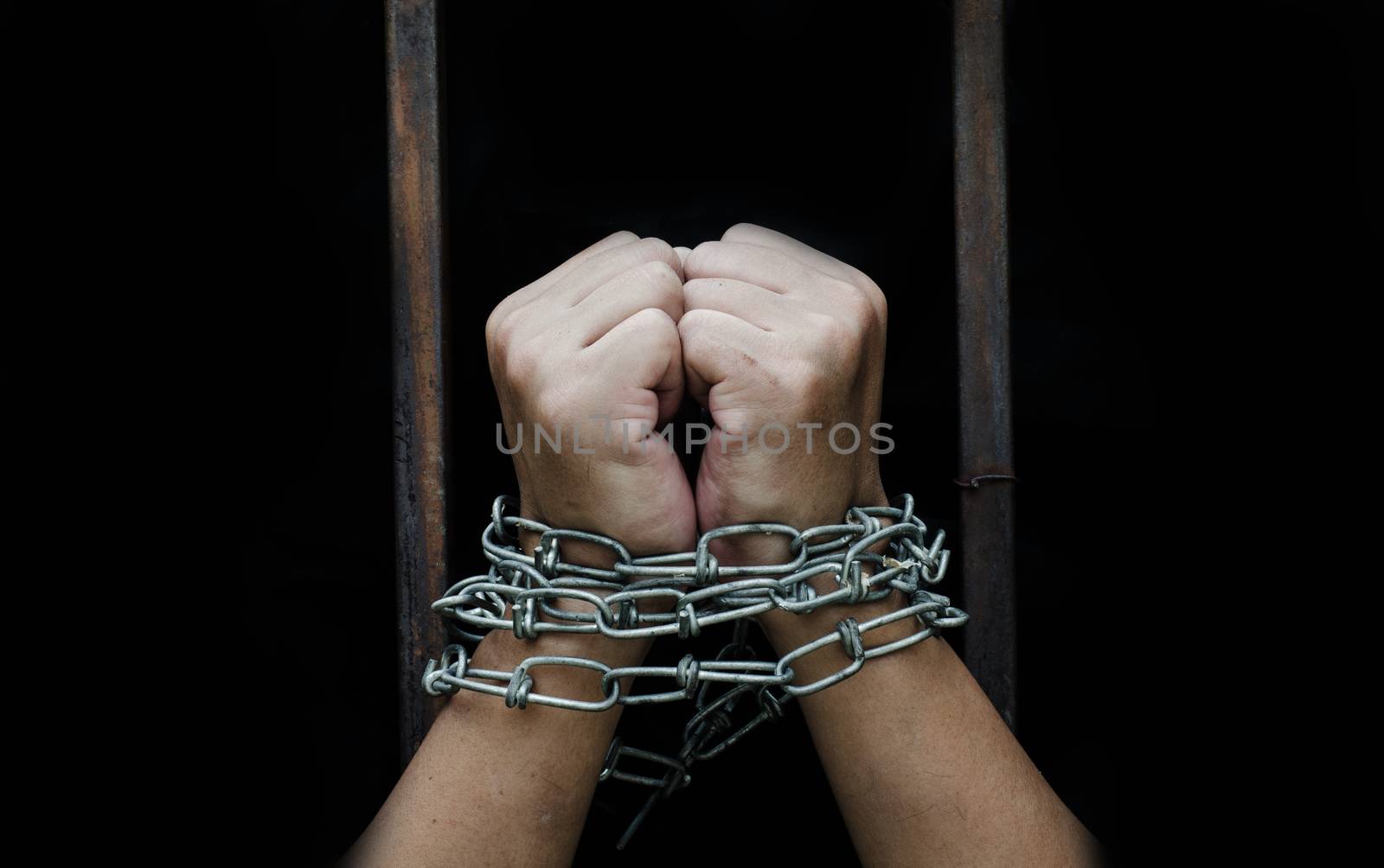 Chained hand sticking out of the priso