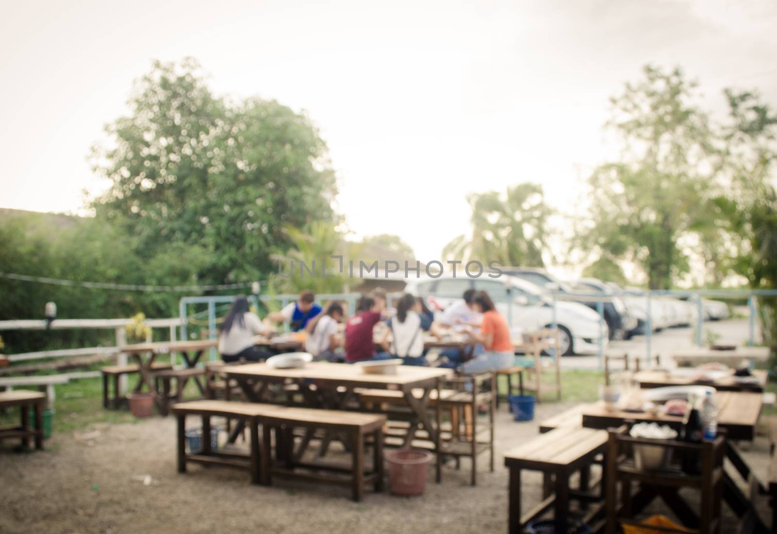 Blur restaurant with customers to access services.