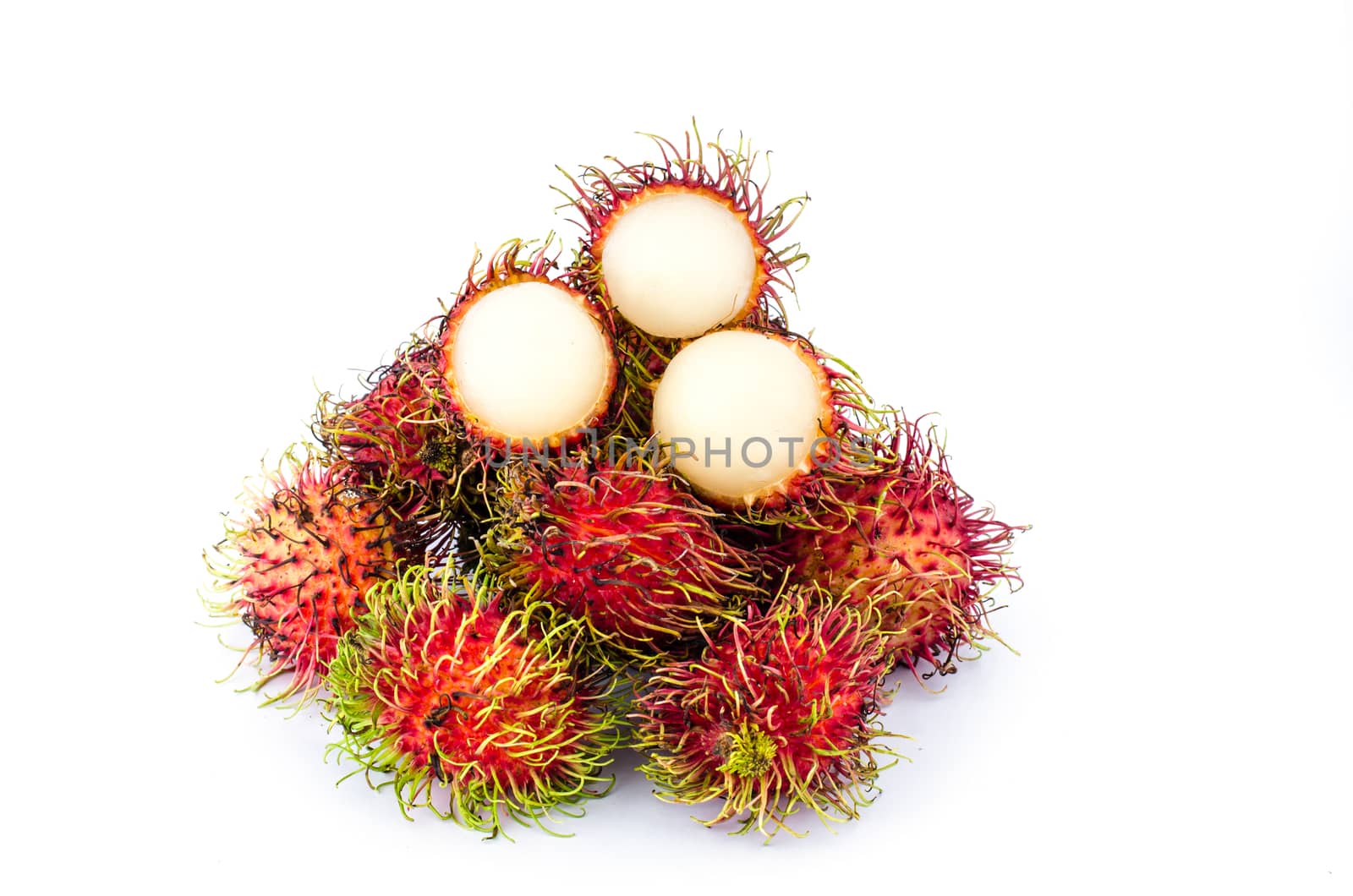 Thailand red rambutan fruit is sweet on a white background.