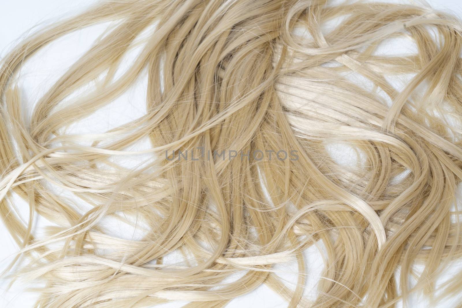 long blonde hair lying on a white surface